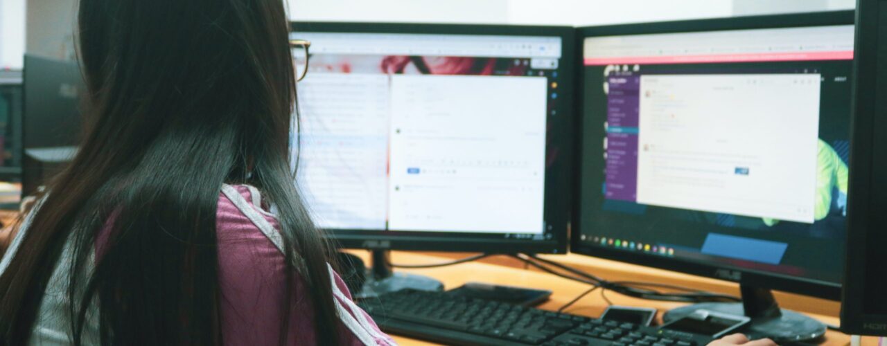 woman using desktop computer