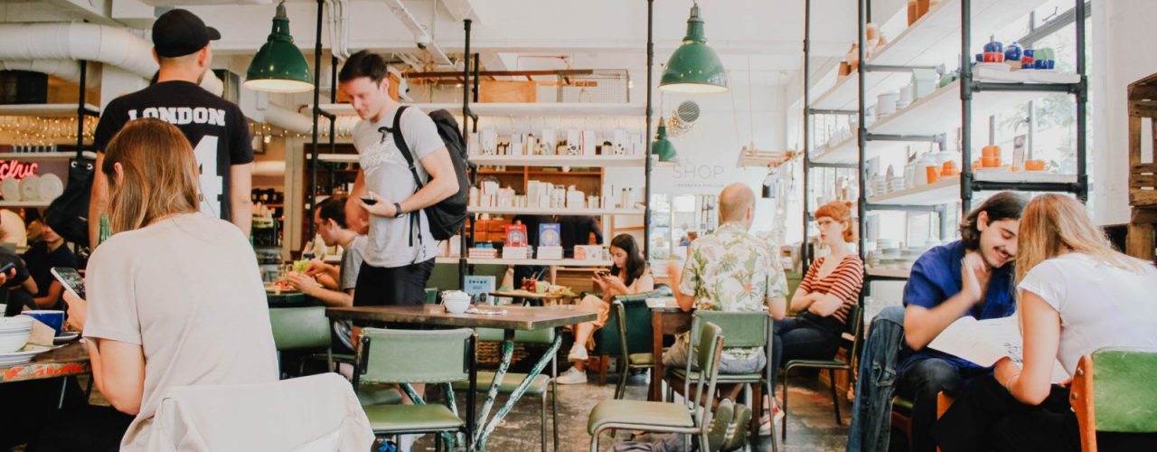 people eating inside of cafeteria during daytime