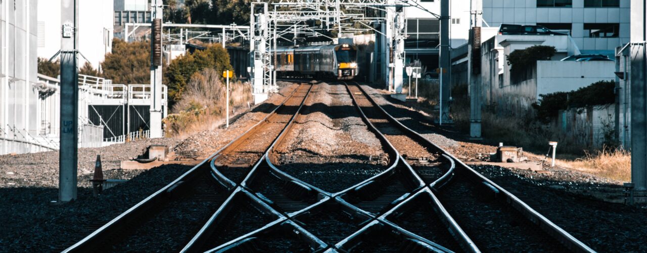 train tracks in the city during daytime