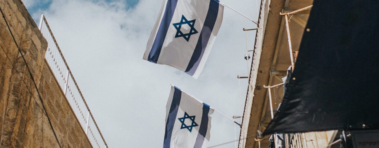 flags hanging on roof during daytime