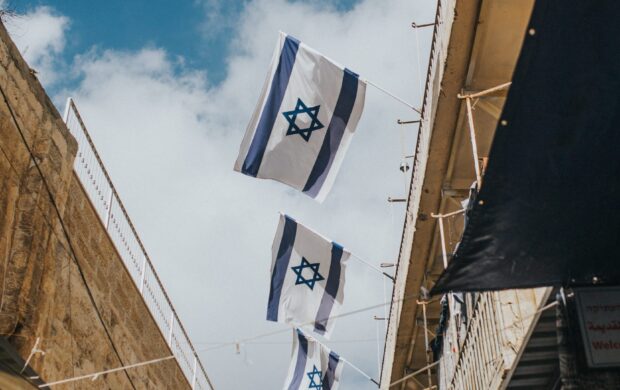 flags hanging on roof during daytime