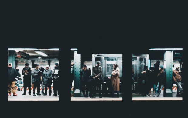 people standing and waiting on train station