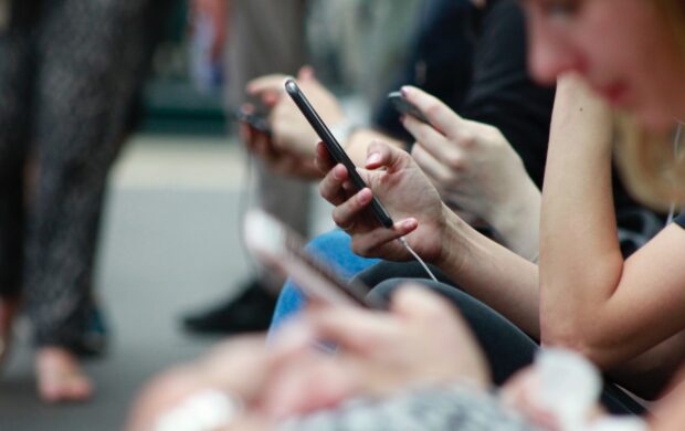 person holding black phone