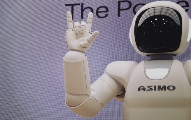 Asimo robot doing handsign