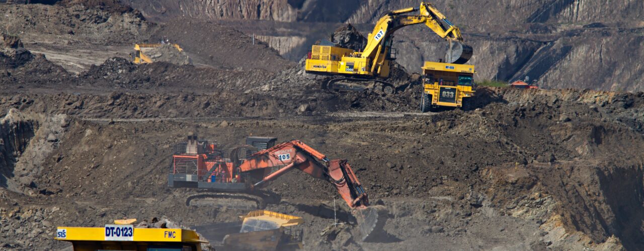 photography of excavators at mining area