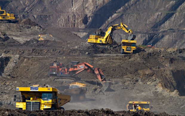 photography of excavators at mining area