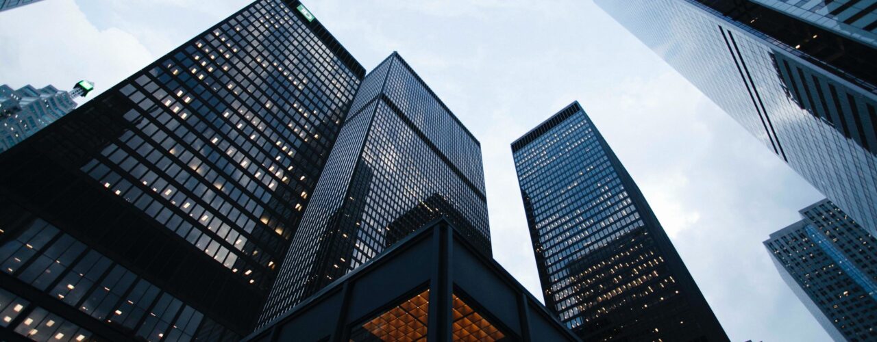 low angle photo of city high rise buildings during daytime