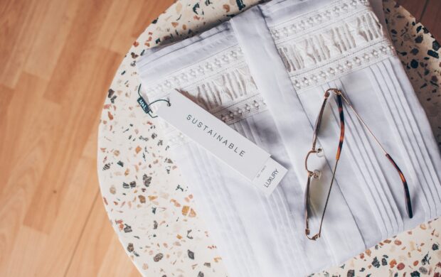 silver framed eyeglasses on white and blue floral textile