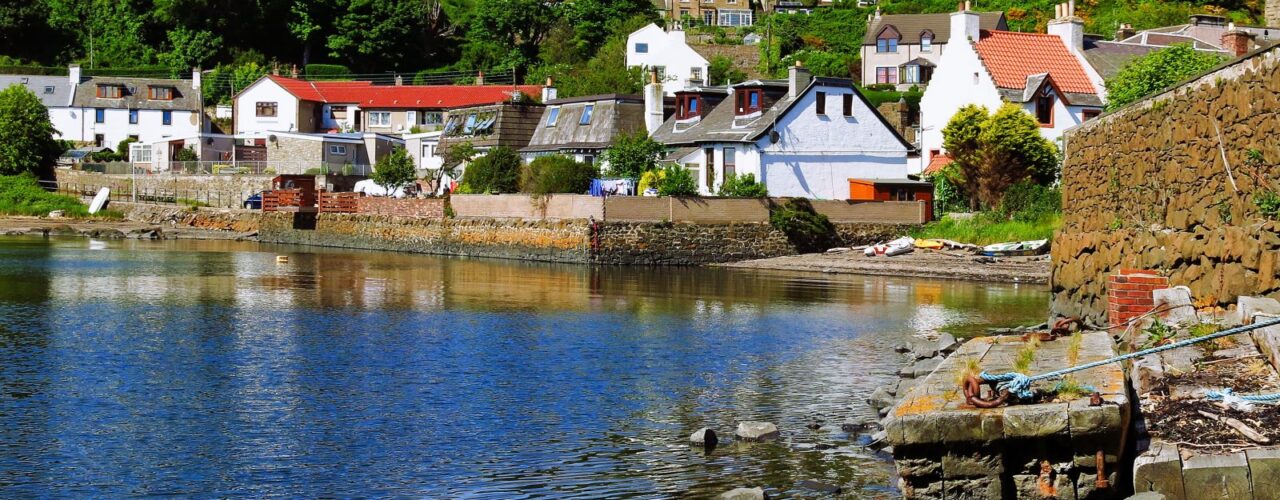 houses near river during daytime