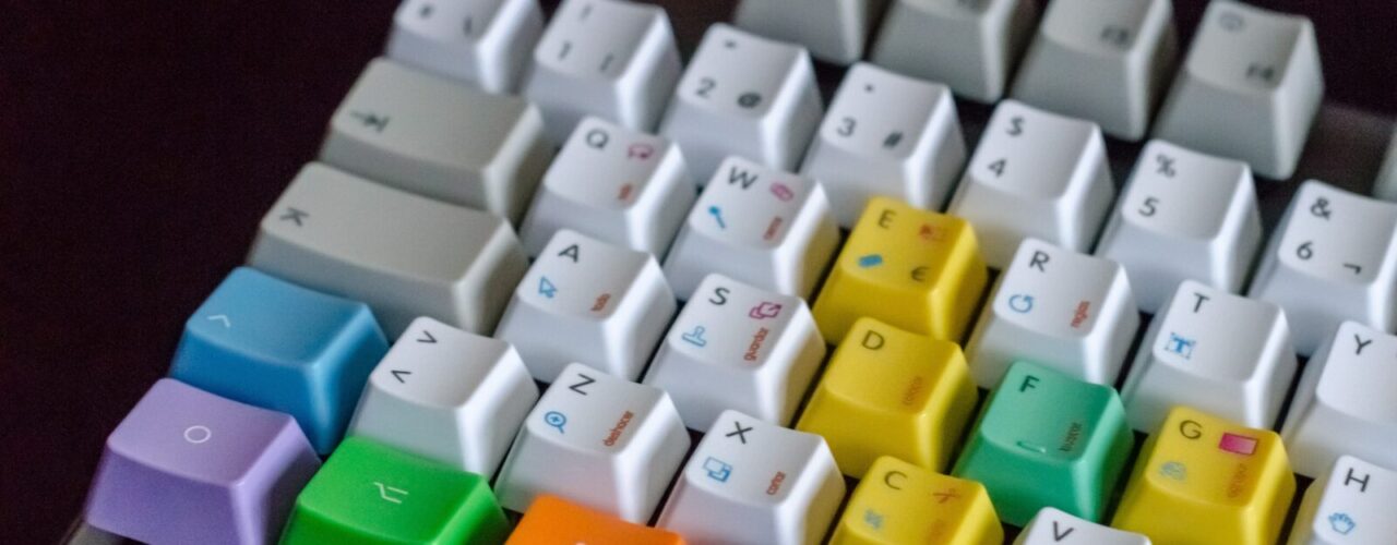 white, orange, green, and purple computer keyboard