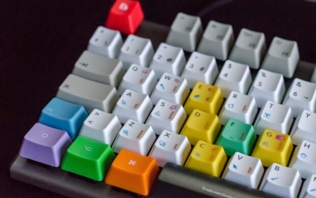 white, orange, green, and purple computer keyboard