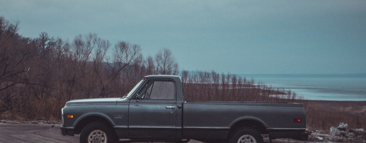 black single cab pickup truck on road during daytime