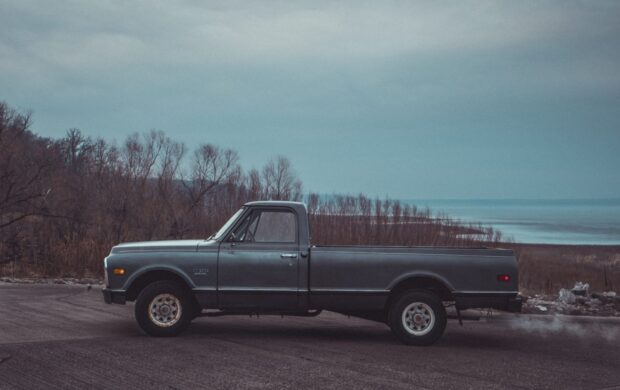 black single cab pickup truck on road during daytime