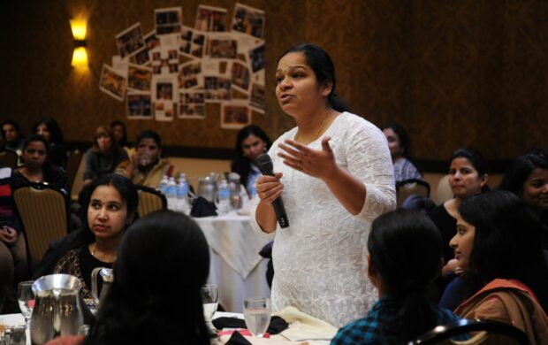 woman holding microphone