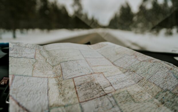 macro photography of map chart inside car