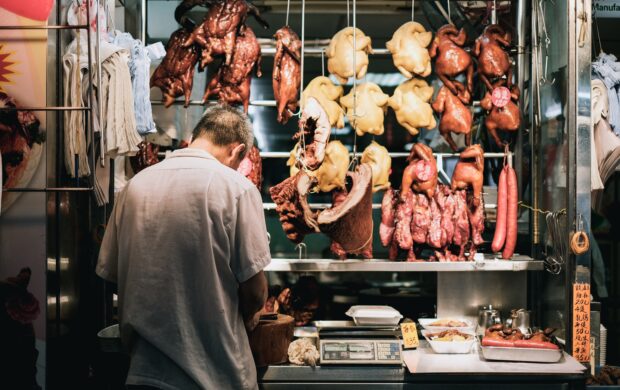 man standing on store