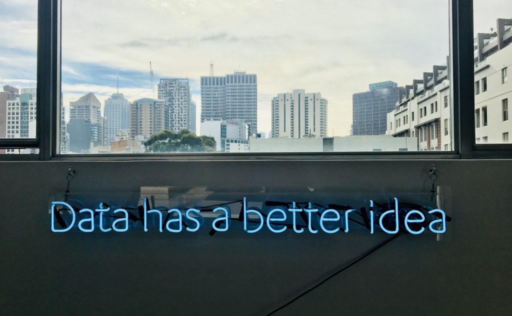 white building with data has a better idea text signage