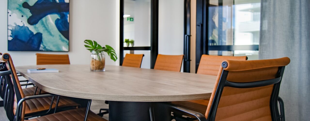 brown wooden 9-piece office table and chairs