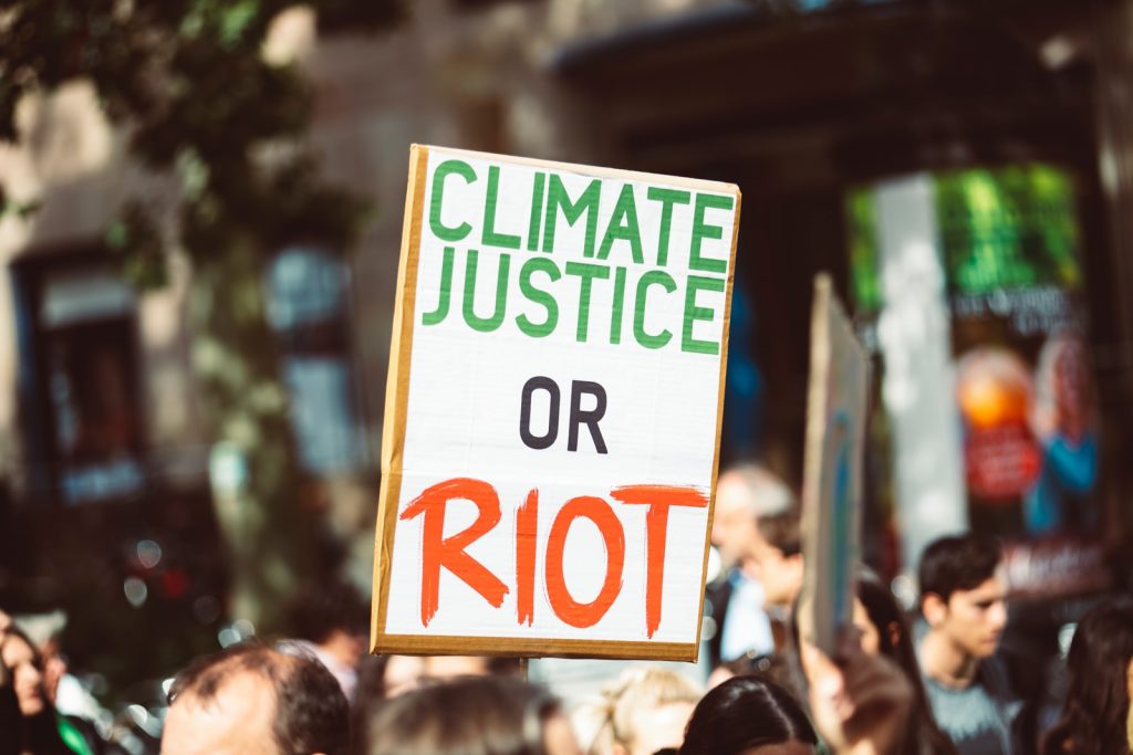 climate justice or riot signage