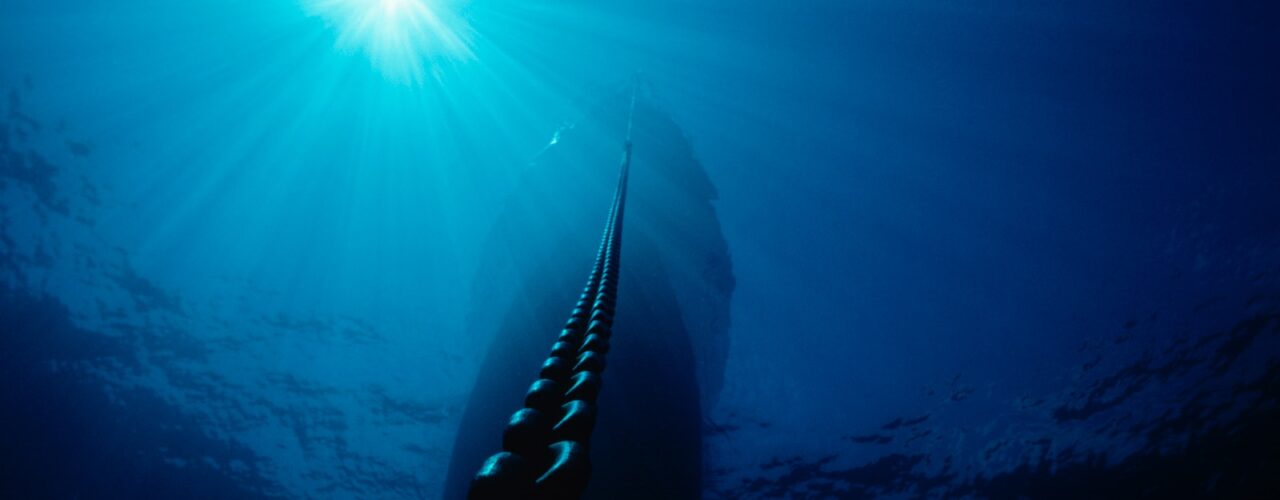 low angel photography of ship anchor chain