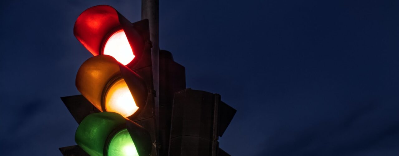 black traffic light turned on during night time