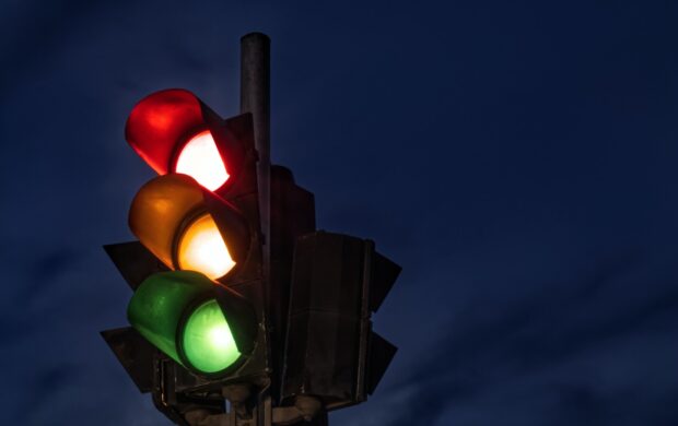 black traffic light turned on during night time