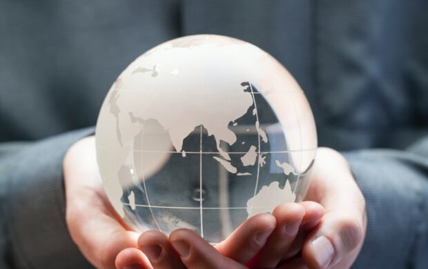 shallow focus photo of clear glass globe table ornament
