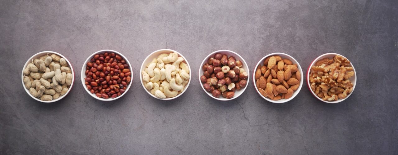 brown nuts on white ceramic bowls