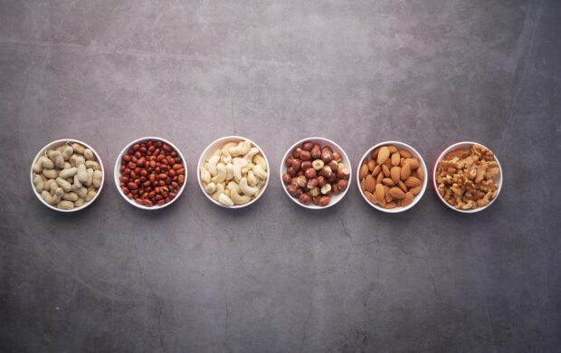 brown nuts on white ceramic bowls