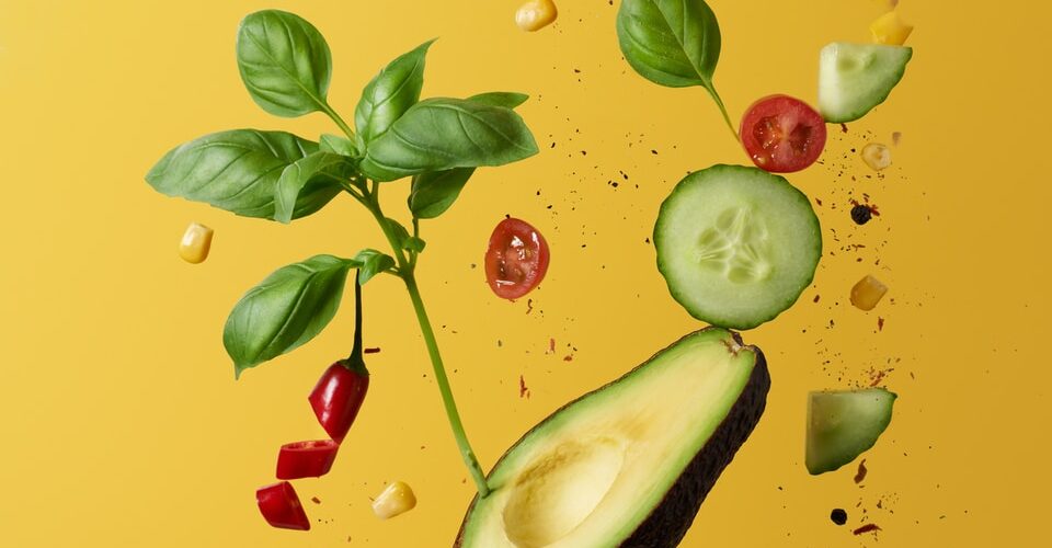 green and red fruit with green leaves