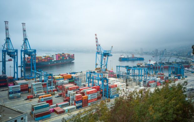 blue and red cargo ship on sea during daytime