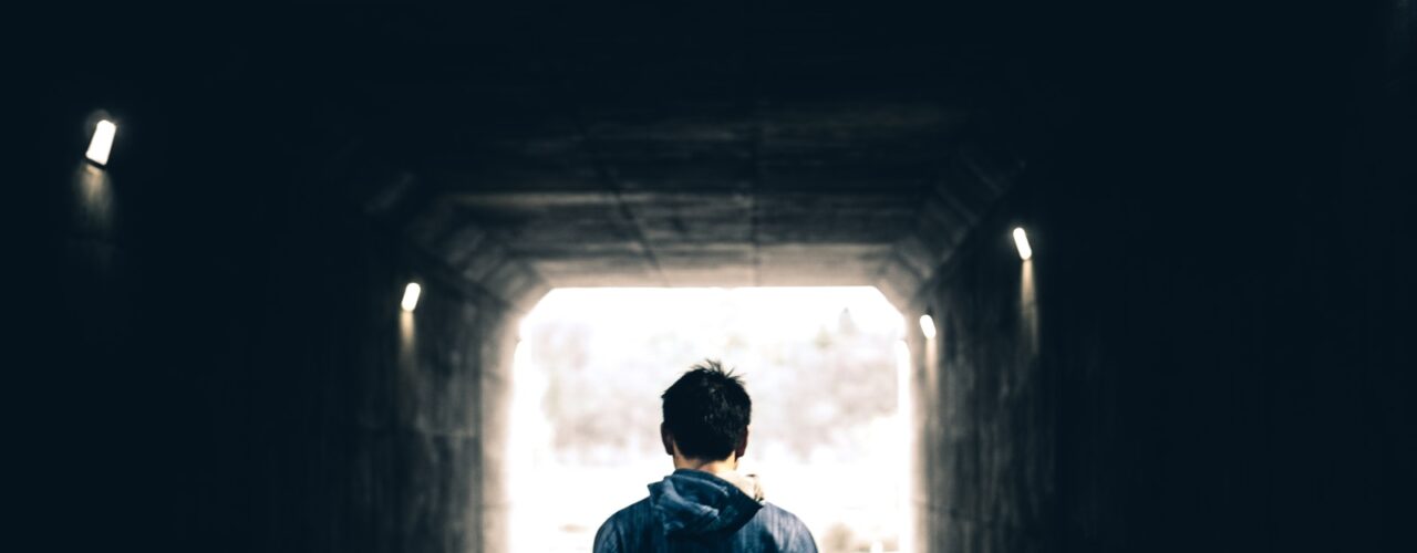 man standing in subway