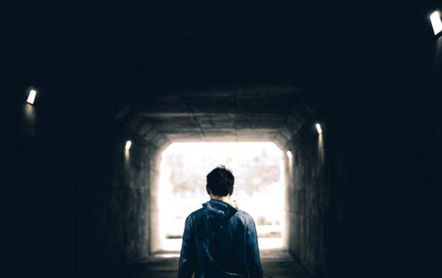 man standing in subway