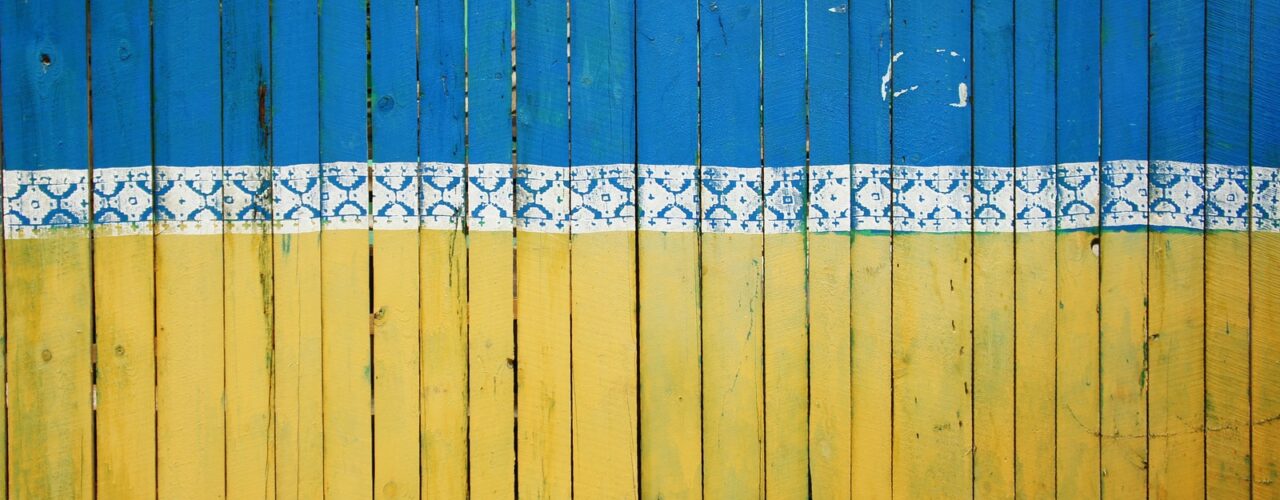 yellow and blue wooden fence