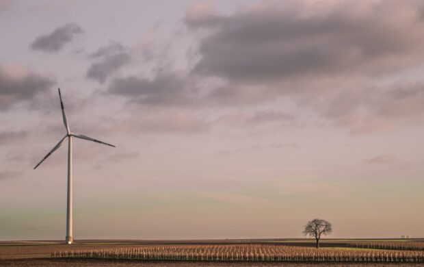 windmill under cloudy sky during daytime