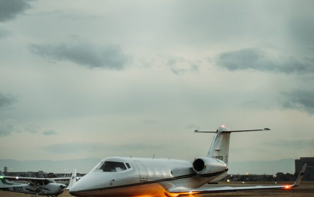 white airplane on the airport during daytime