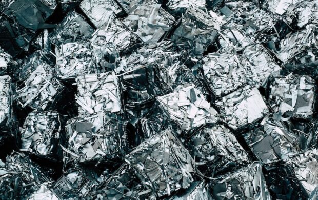 a pile of silver foil sitting on top of a pile of silver foil