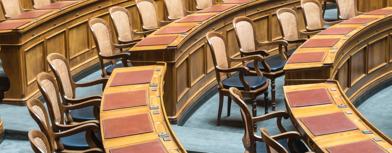 brown wooden chairs on blue and brown wooden floor