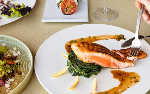 cooked fish on white ceramic plate