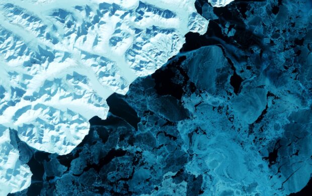 an aerial view of a snow covered mountain