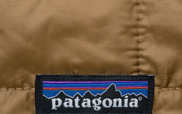 a patagonia jacket with a patch on the back