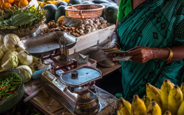 woman in front of stainless steel scale