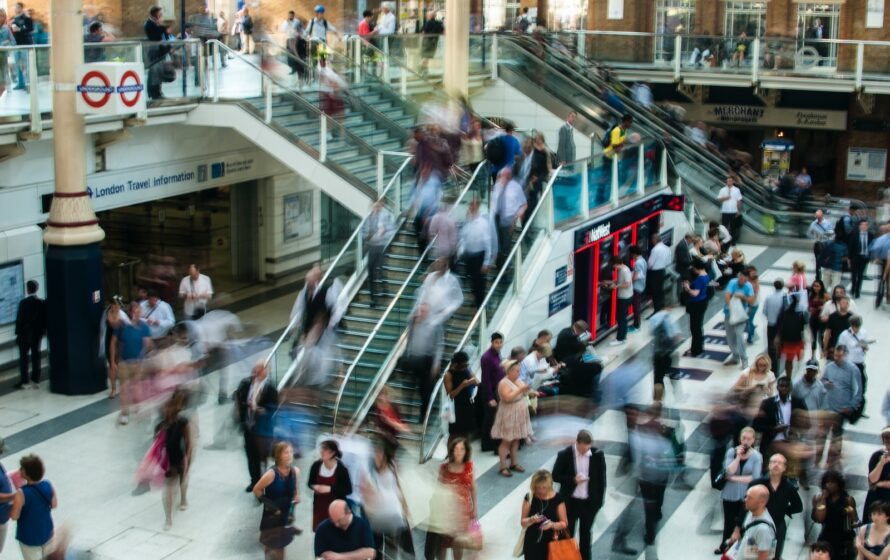 people standing and walking on stairs in mall